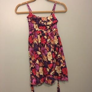 purple dress with pink, red, & white floral design